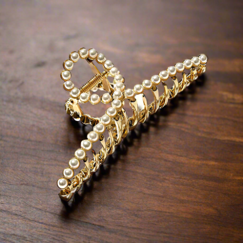 Long gold clip with white pearl accessory