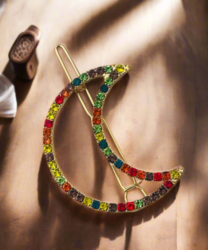 Multi-colored crescent-shaped hair accessory