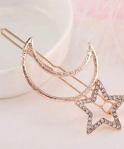 Hair Accessory Bronze in the shape of a crescent moon containing a star